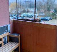 Balcony with a wooden bench, view of parked cars, Ján Poničan Street, Bratislava - Devínska Nová Ves.