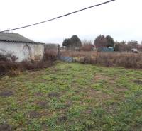 A garden at a family house in Kravany nad Dunajom with grassy and soil areas.