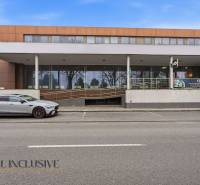 Commercial premises in Topoľníky with a modern building and parking in front of the entrance.