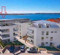 View of the sea bay with a holiday apartment in the town of Pag, modern architecture by the coast.