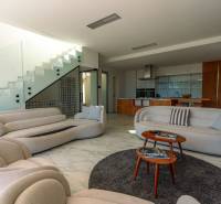 A bright interior of the villa with a spacious living room, modern kitchen, and comfortable furniture.