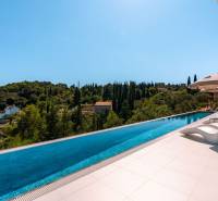 A pool at a villa in the town of Korčula with a view of the surrounding nature.