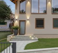 A family house in Chrenová, Nitra with a renovated facade, large windows, and a staircase.
