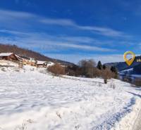 Snow-covered cottages on Recreational Land in Fongrube in Mýto pod Ďumbierom.