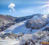 Snowy landscape, ski slope and cottages in Mýto pod Ďumbierom, ideal for living.