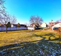 The garden of a family house on Sadova Street in Borský Mikuláš, covered with fine snow.