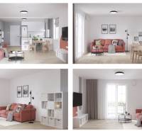 Interior of a 2-room apartment with a wooden decor floor, a red sofa, and a dining table.