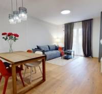 Interior of a 2-room apartment with a wooden decor floor and modern lighting.