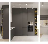 A kitchen in a studio apartment with dark cabinets and storage space.