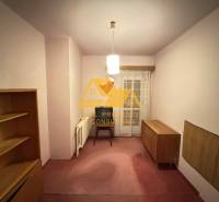 A room in a family house with furniture and curtains, without a floor with a wooden decor.