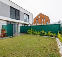 The exterior of a 2-room apartment on Jaspisova Street in Jarovce with a terrace and lawn.