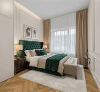 Bedroom with a bed, nightstands, pictures on the wall, and a floor with a wooden decor.