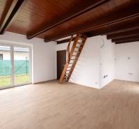 Interior of a family house with a ladder staircase and a wooden decor floor.