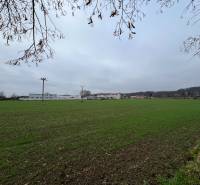 Greenery and buildings in Pruske, commercial plots spread in the background.