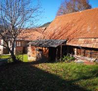 A family house on Kalameny Street in Ružomberok with a wooden annex in the yard.