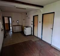 A kitchen in a family house with a wooden decor countertop and floor.