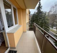 The balcony of a 3-room apartment on Golianova Street in Banská Bystrica with a view of greenery.