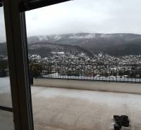 View of the snowy landscape in Nová Baňa from the balcony of an apartment on Pod sekvojou Street.
