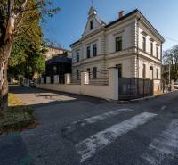 A historical building with a modern extension and greenery on Južná trieda, Juh district, Košice.