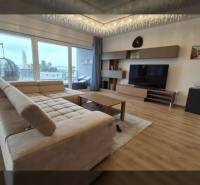 Living room in a Holiday Apartment with a sofa and wooden decor flooring.