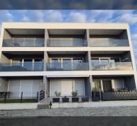 Three-story vacation apartment in the town of Vrsi, on Zukve Street, with balconies and glass railings.