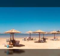 A beach with loungers and umbrellas by the sea in the town of Ljubač for living.