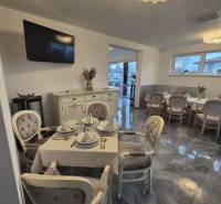 Silk decor Gastro spaces with dining, wooden decor flooring, soft lighting.