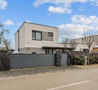 A family house on Topoľová Street in Rovinka, with a modern fence and minimalist design.