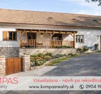 A family house with a gable roof and a stone wall in the village of Vígľašská Huta-Kalinka.