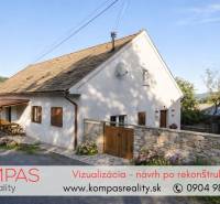 House by the road with a wooden terrace and flowers in the village of Vígľašská Huta-Kalinka.