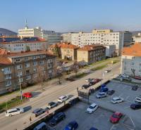 Street with buildings and parked cars in Košice, Sever district, Letná.