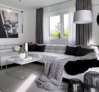 A stylish living room with a corner sofa and decorative elements in a three-room apartment.