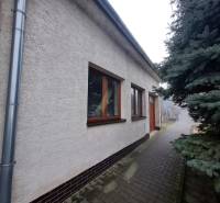 A family house on 1st May Square in Chtelnica with a landscaped exterior and a tree.