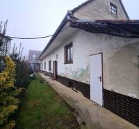 Family house on Námestie 1. mája in Chtelnica with a grassy yard and garden greenery.