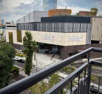 View from the balcony of the Nivy shopping center in Bratislava with modern architecture.