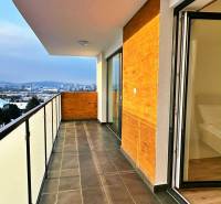 Balcony of a 3-room apartment with a view of Prešov, Solivarská 14, large glass doors.