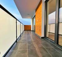 Safe balcony railing and dark tiles on the balcony of a 3-room apartment.