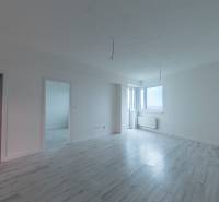 A bright interior with a wood-decor floor in a 2-room apartment.