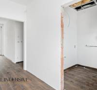 Interior of a family house with a wooden decor floor and heating equipment.