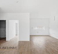 Interior of a family house with a wooden decor floor and white walls.