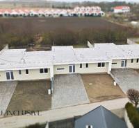 A family house in Čukárska Paka in Veľká Paka with yards and parking spaces.