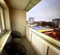 The balcony of a 3-room apartment on Jašíkova Street in Bratislava-Ružinov with a view of the city.