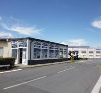 Building with garages and trucks on Strojnícka Street in Prešov, warehouses and halls.