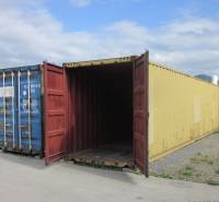 An open yellow container on Strojnícka Street in Prešov near warehouses and halls.