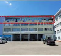 Office building on Stará Vajnorská, Bratislava - Nové Mesto. Parking lot in the foreground.