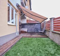 Exterior of a 2-room apartment with a terrace and wooden decor flooring on M.R. Štefánika Street in Most pri Bratislave.