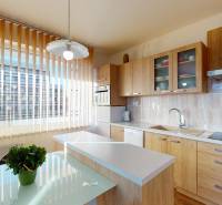 A kitchen with a wooden decor floor in a 2-room apartment, light furnishings, and a large window.