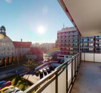 The balcony of a 2-room apartment with a view of a historic building on Strojárenská Street in Košice.