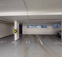 Underground garage with parking spaces and columns in the building on Strojárenská in Košice.