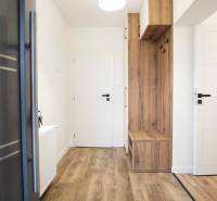 Interior of a family house with a wooden decor floor and built-in furniture.